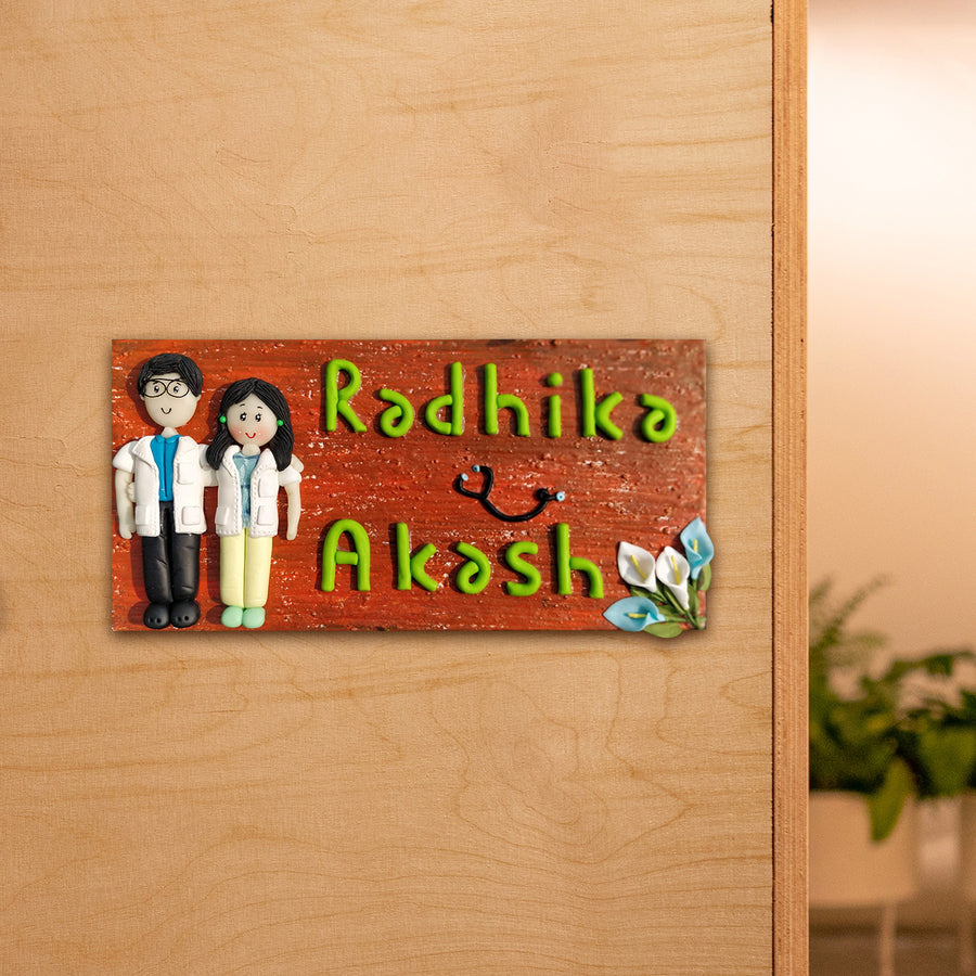Handcrafted Personalized Clay Caricature Couple Name Plate For Doctors - Mounted on Wooden Door Close-up