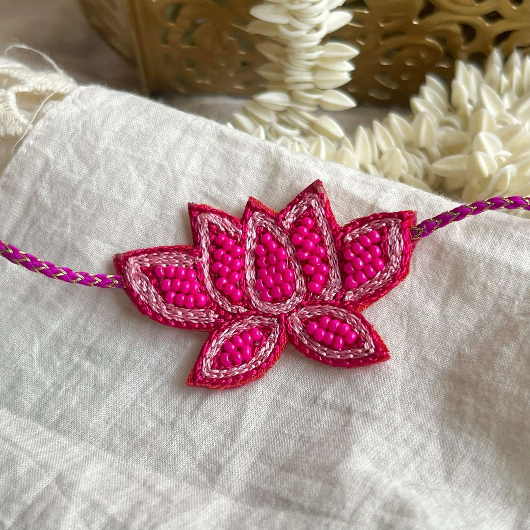 Handmade Beaded Lotus Rakhi With Roli Chawal - Decorative Display on Fabric