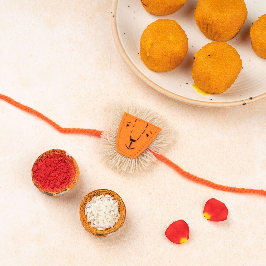 Handcrafted Kids Rakhi With Roli Chawal Set Of 2 - Styled Product with Lion Rakhi