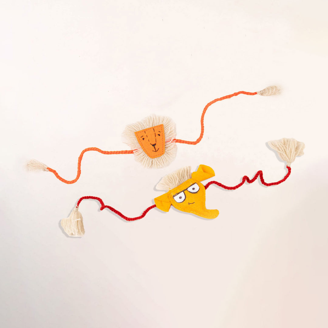 Handcrafted Kids Rakhi With Roli Chawal Set Of 2 - Flat Lay Showing Both Rakhis