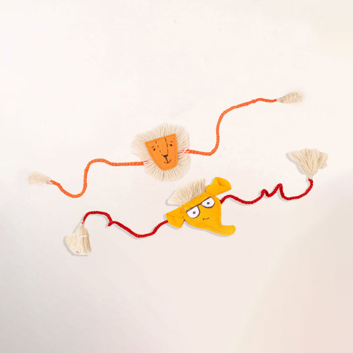 Handcrafted Kids Rakhi With Roli Chawal Set Of 2 - Flat Lay Showing Both Rakhis