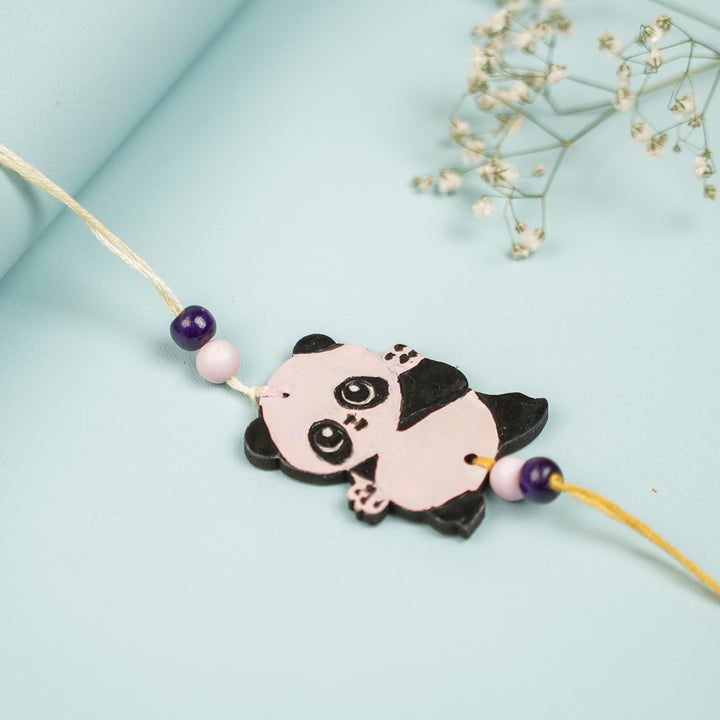 Hand Painted Panda Design Mdf Wood Kids Rakhi - Angled View of Panda Charm Bracelet