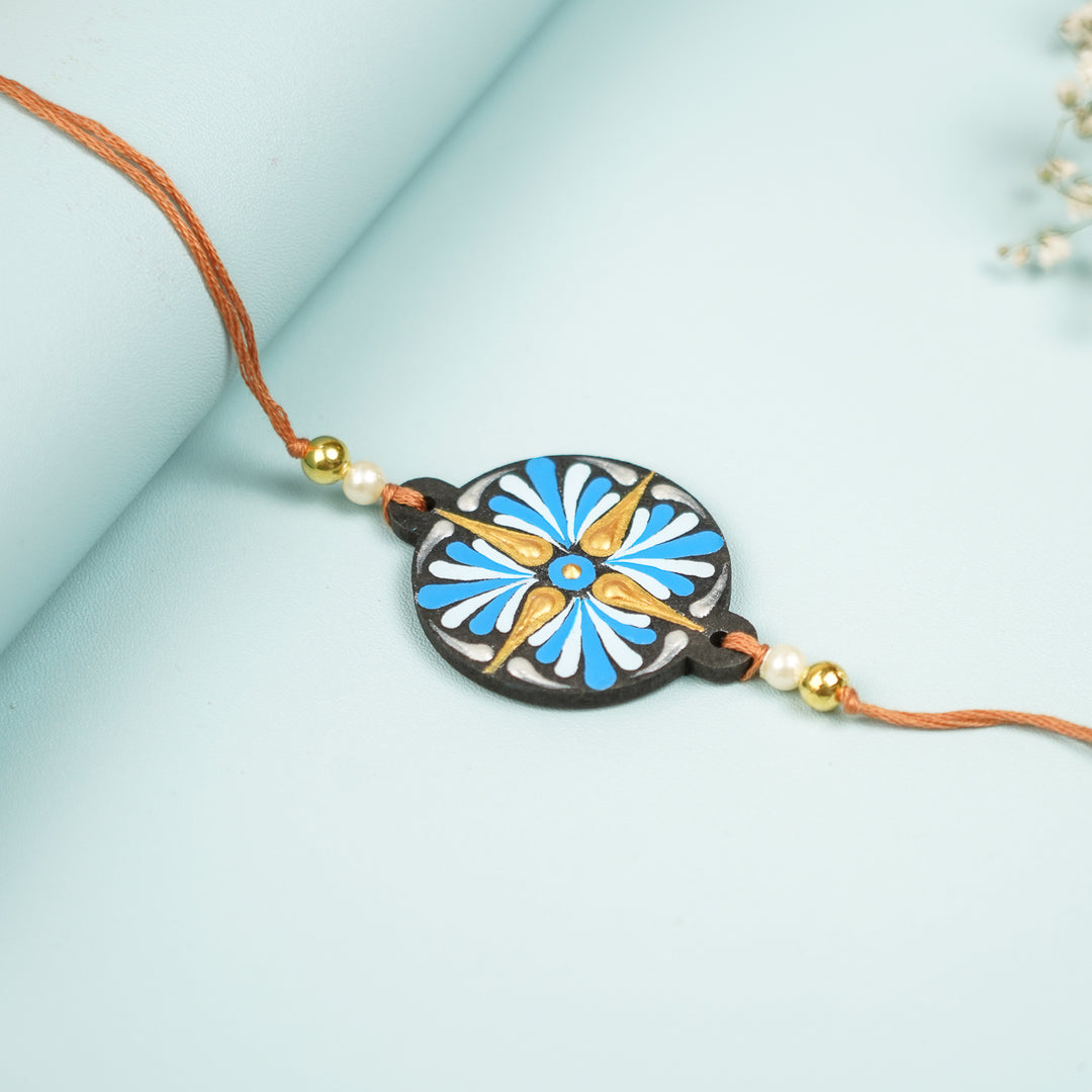 Customized Hand Painted Dot Mandala Ethnic Round Mdf Wood Rakhi - Close-up Front View with Background