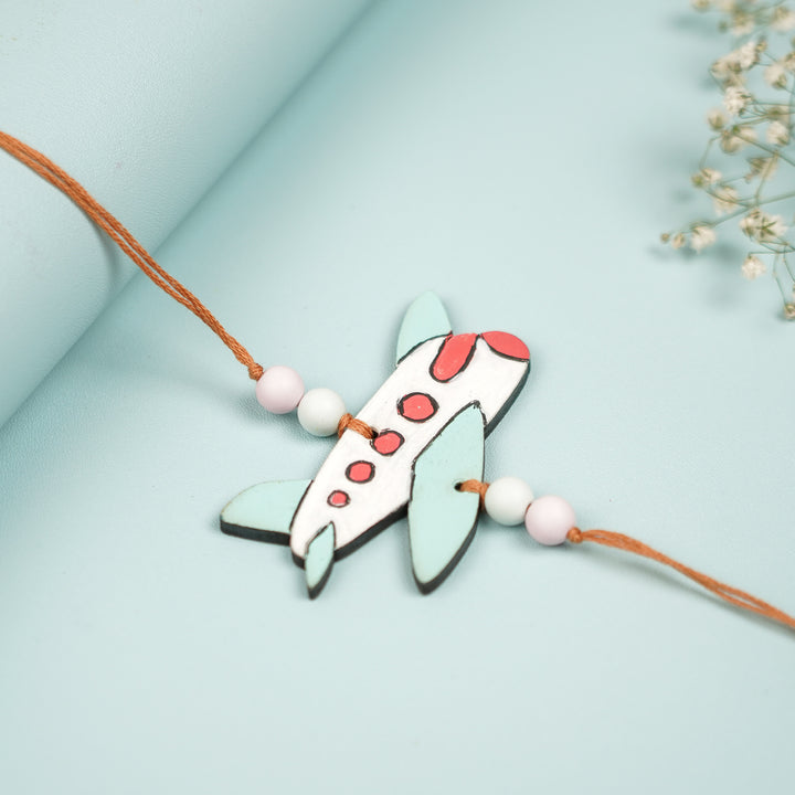 Hand Painted Aeroplane Design Mdf Wood Kids Rakhi - Angled View of Plane Charm Bracelet