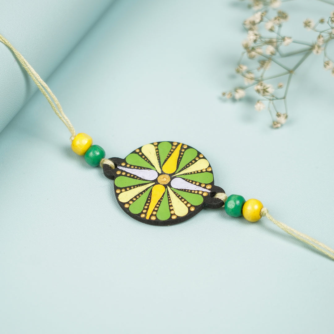 Customized Hand Painted Dot Mandala Ethnic Round Mdf Wood Rakhi - Flat Lay Front View with Background