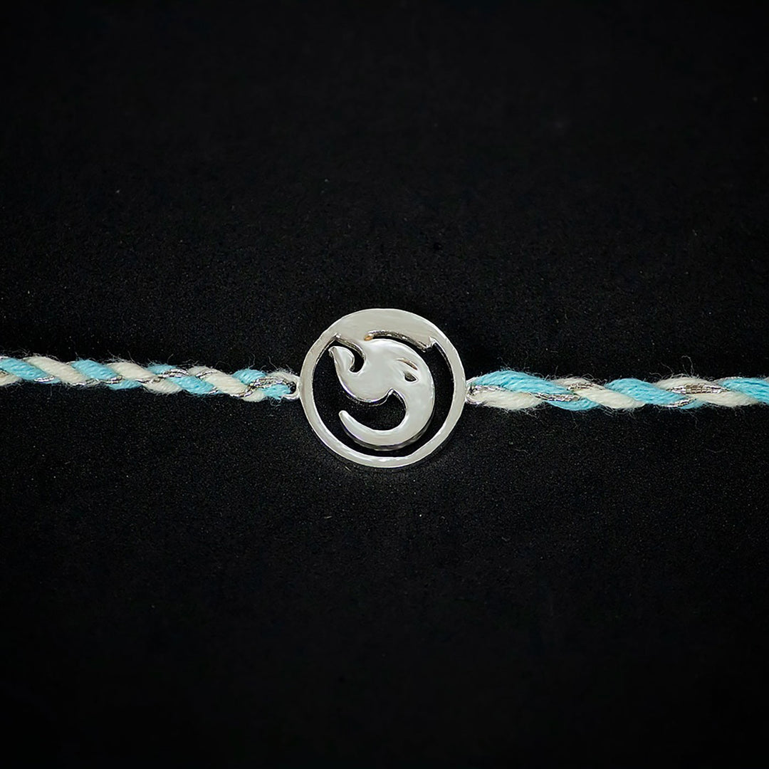 Handmade Ashtavinayak 925 Silver Rakhi With Roli Chawal For Brother - Close-up of symbol charm