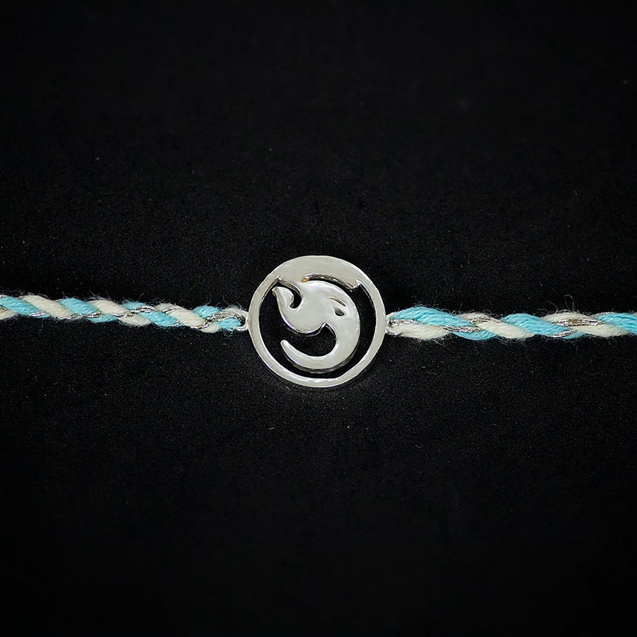Handmade Ashtavinayak 925 Silver Rakhi With Roli Chawal For Brother - Close-up of symbol charm