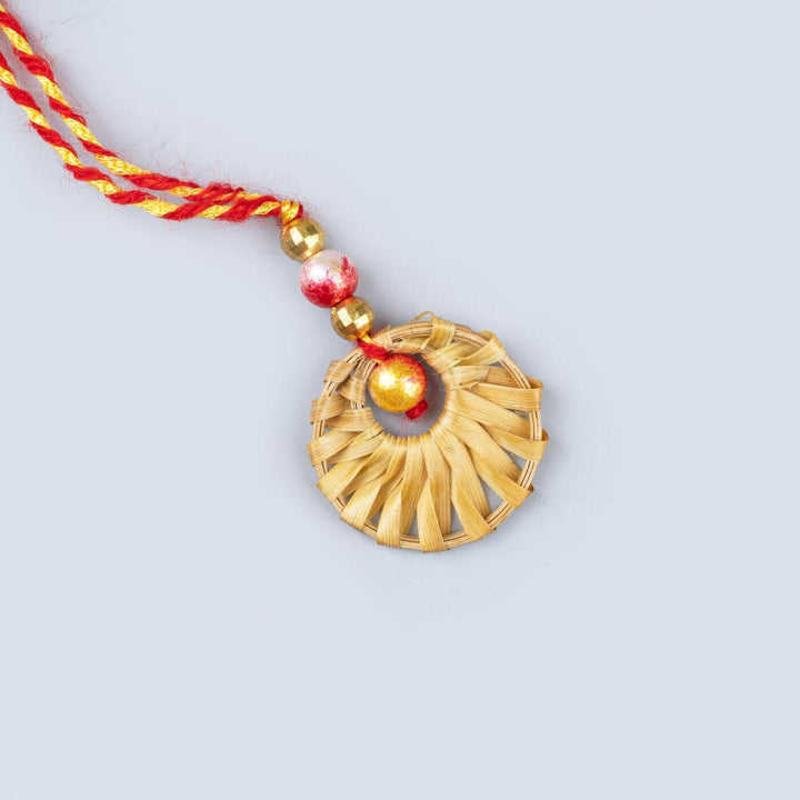 Ecofriendly Bamboo Rakhis For Bhaiya Bhabhi With Roli Chawal 2 - Close-up of Single Rakhi Pendant
