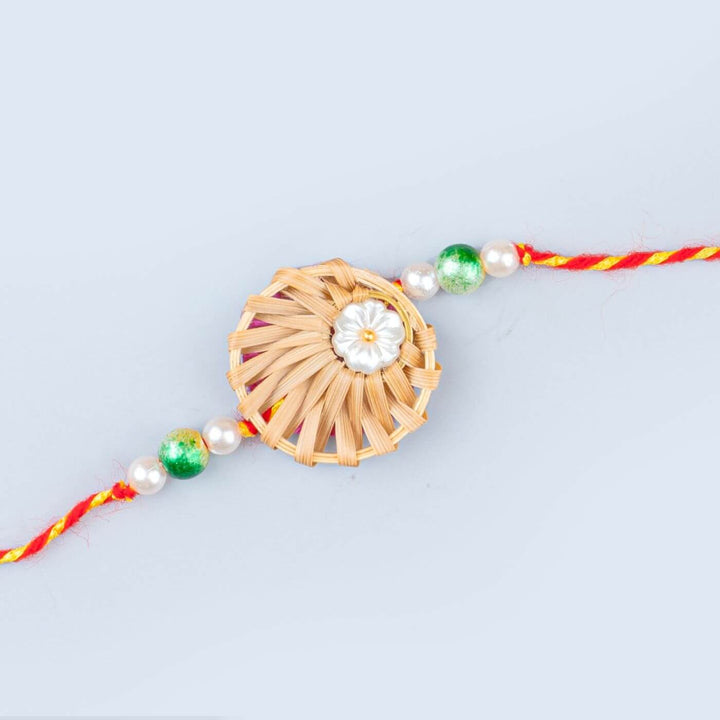 Ecofriendly Bamboo Rakhis For Bhaiya Bhabhi With Roli Chawal 3 - Close-up of flower pendant detail
