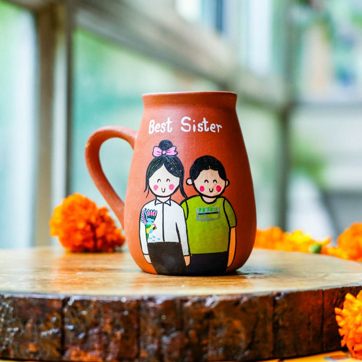 Personalized Best Sister Terracotta Mug And Rakhi Set - Mug on Wooden Surface