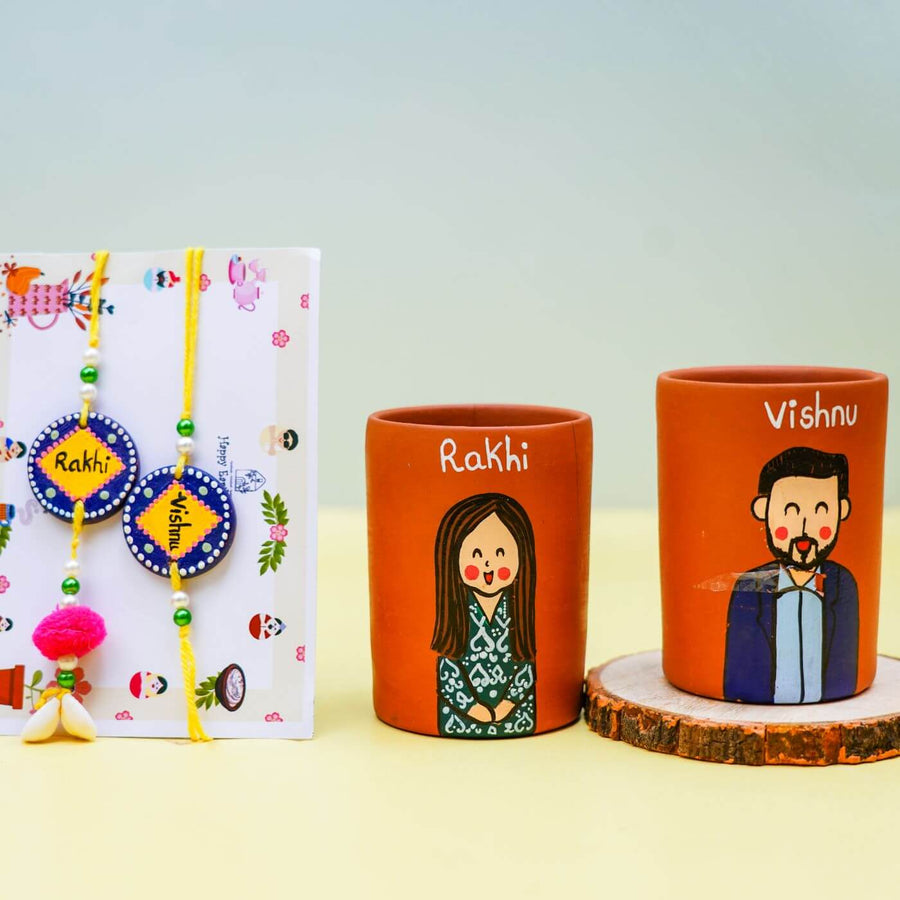 Personalized Terracotta Tumbler Rakhi Set With Caricature - Front View with Rakhis and Mugs