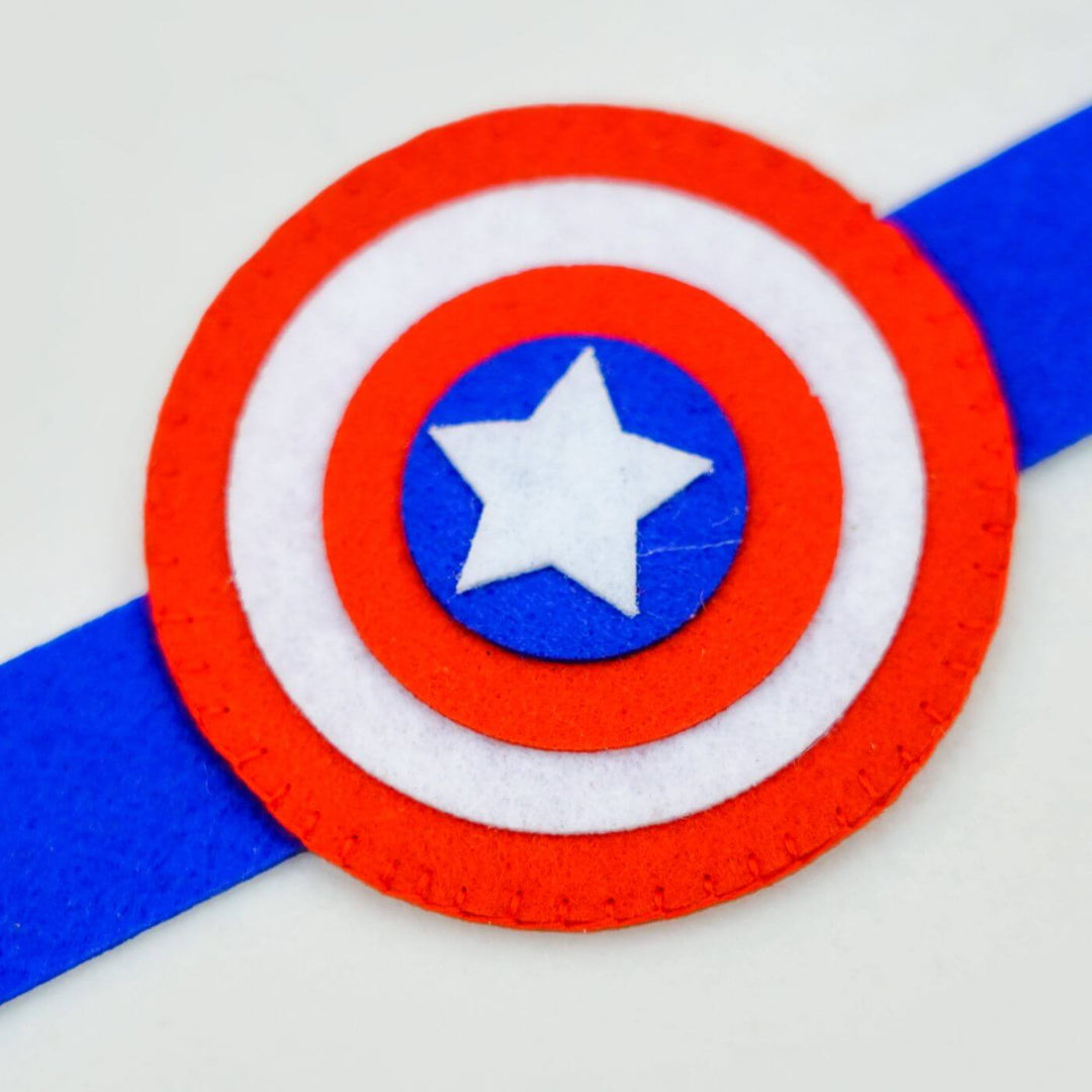Kids Theme Felt Rakhi Band With Roli Chawal 2 - Close-up of Captain America emblem