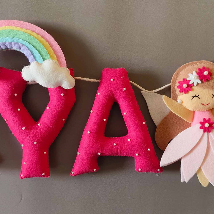 Hand Stitched Fairy Themed Felt Kids Name Plate - Close-up of Hanging Letter and Doll Garland