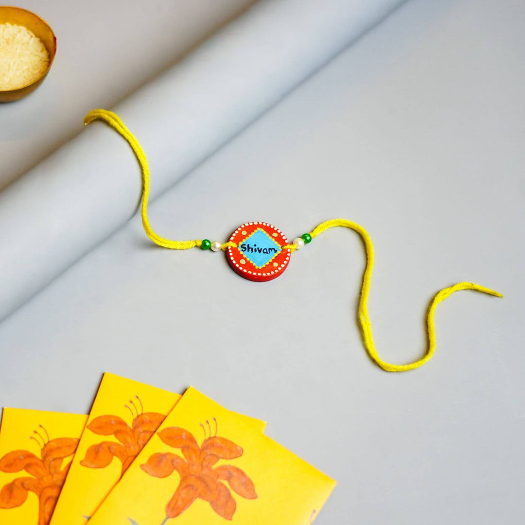 Personalized Terracotta Rakhi Hamper With Caricature 2 - Single Rakhi with Envelopes