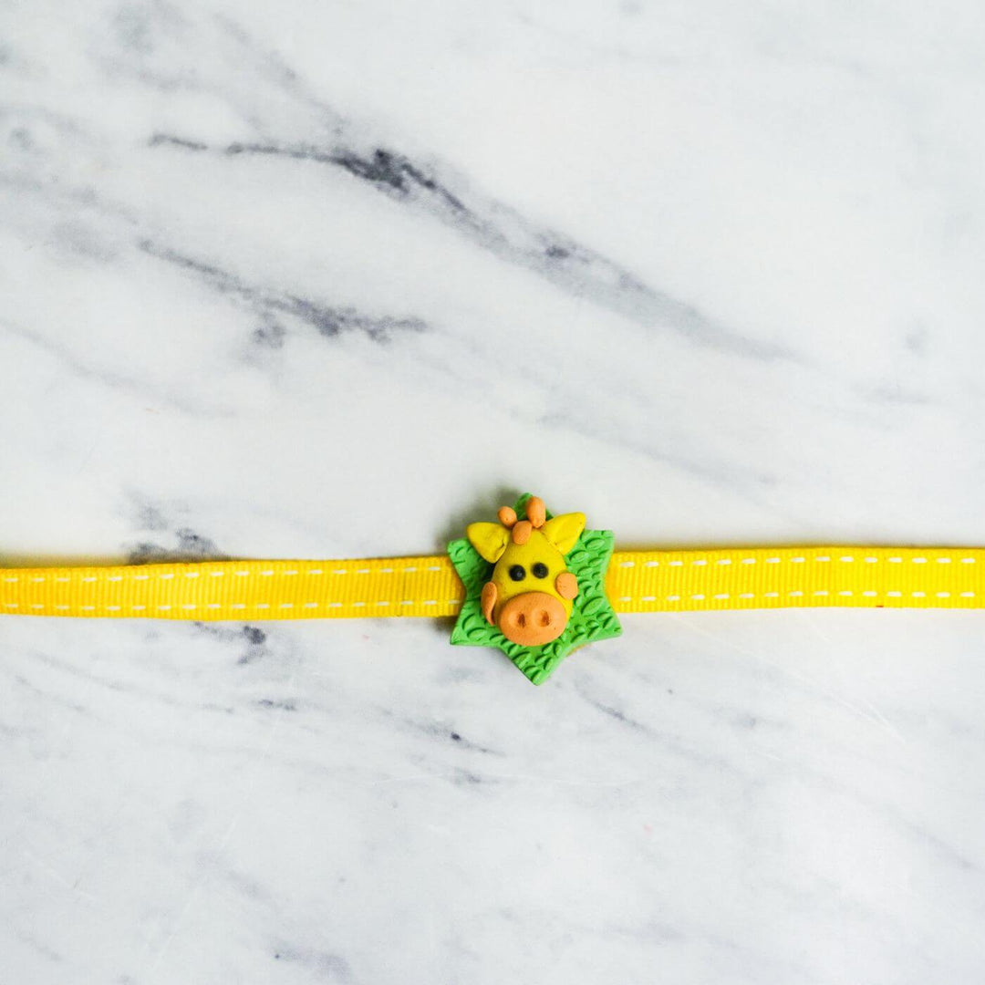 Handmade Porcelain Clay Themed Rakhi 12 - Close-up of Giraffe Rakhi