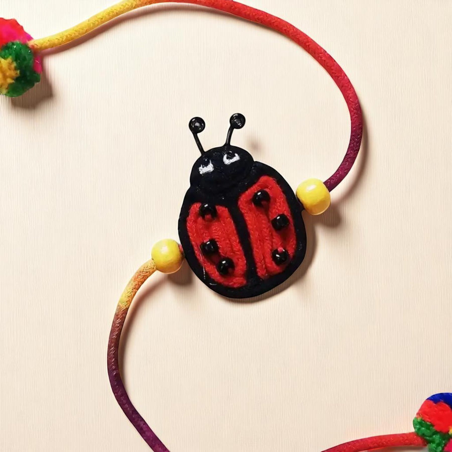 Handmade Dori Work Ladybird Kids Rakhi With Roli Chawal - Close-up Front View