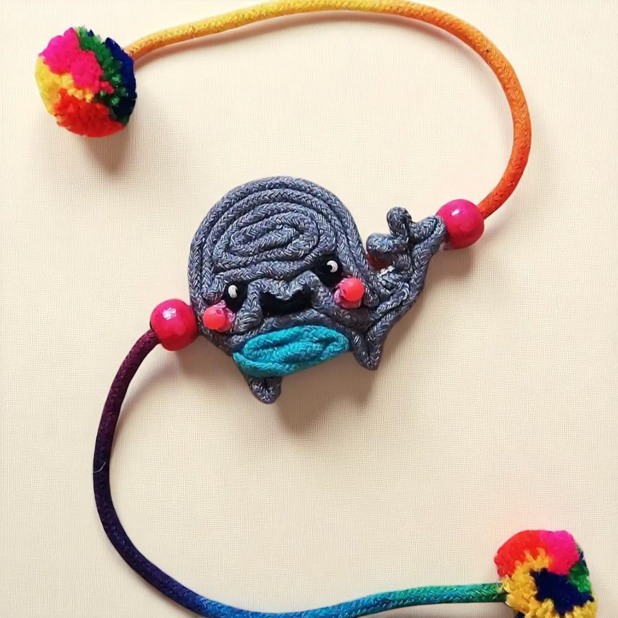Handmade Dori Work Baby Whale Kids Rakhi With Roli Chawal - Front View