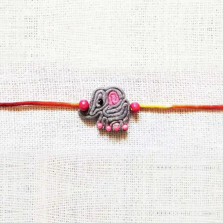 Handmade Dori Work Elephant Kids Rakhi With Roli Chawal - Close-up of Elephant Charm