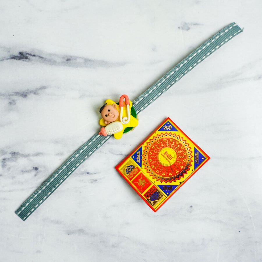 Handmade Porcelain Clay Themed Rakhi 12 - Flat Lay with Matchbox Reference