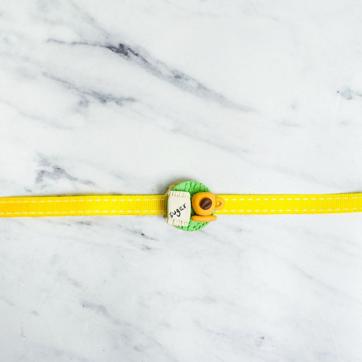 Handmade Porcelain Clay Themed Rakhi 13 - Full product laid flat front view