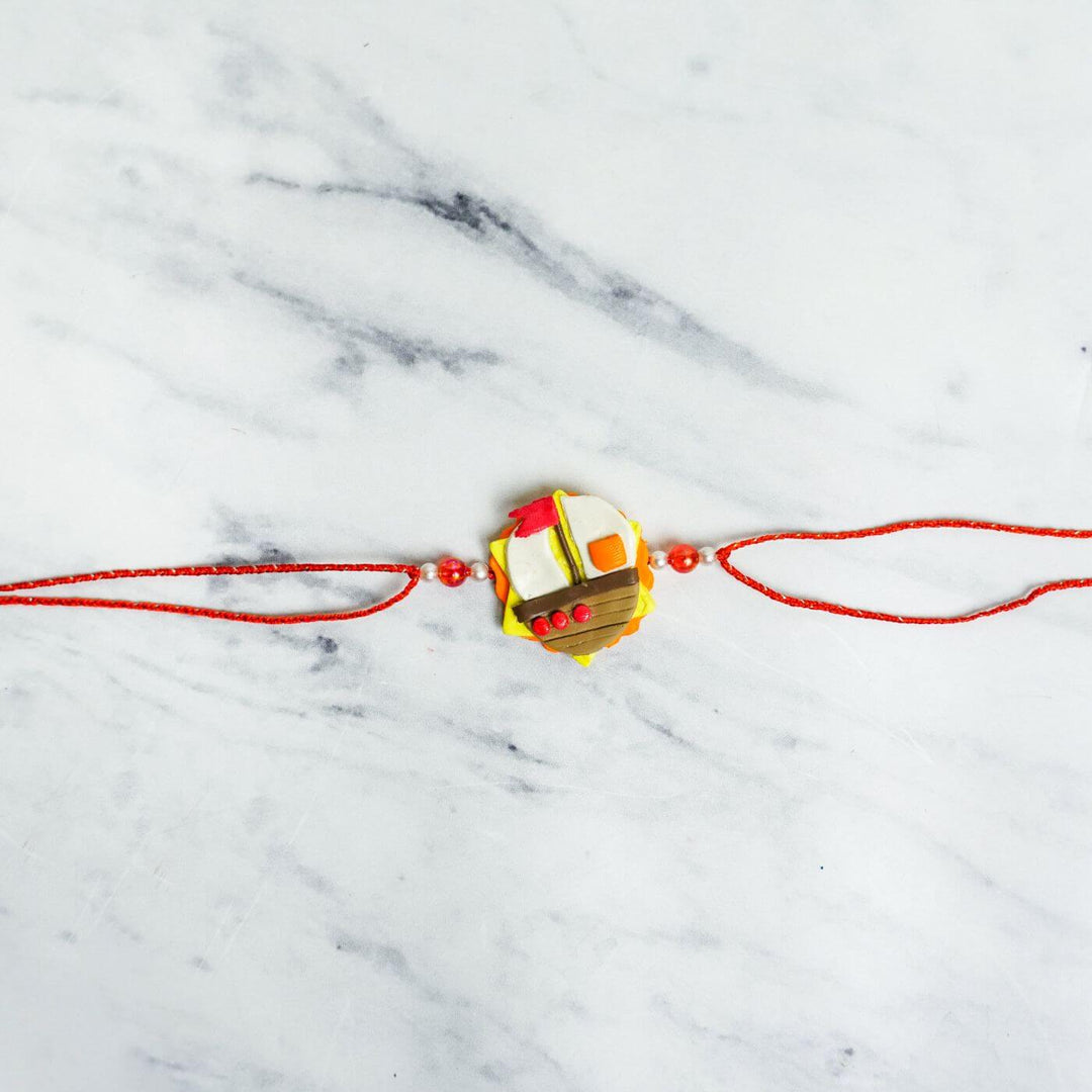 Handmade Porcelain Clay Themed Rakhi 10 - Flat Lay Front View