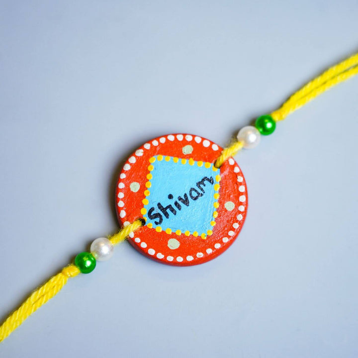 Personalized Terracotta Rakhi Coffee Mug Set With Roli Chawal 1 - Close-up Rakhi Thread and Beads