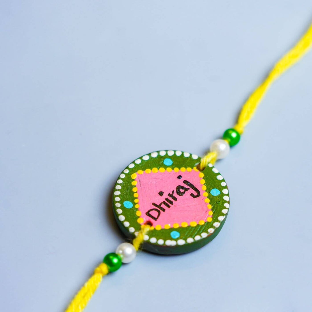 Personalized Terracotta Rakhi Coffee Mug Set With Roli Chawal 2 - Rakhi Close-up with Name Detail