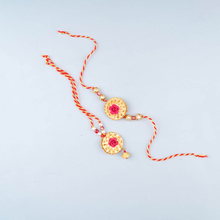 Ecofriendly Bamboo Rakhis For Bhaiya Bhabhi With Roli Chawal 3 - Pair of rakhis with rose embellishment