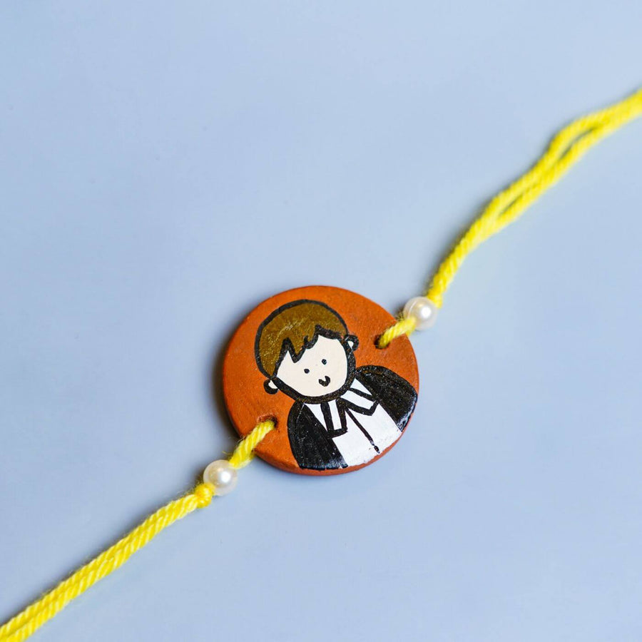 Personalized Profession Theme Terracotta Rakhi With Roli Chawal 2 - Close-up Front View