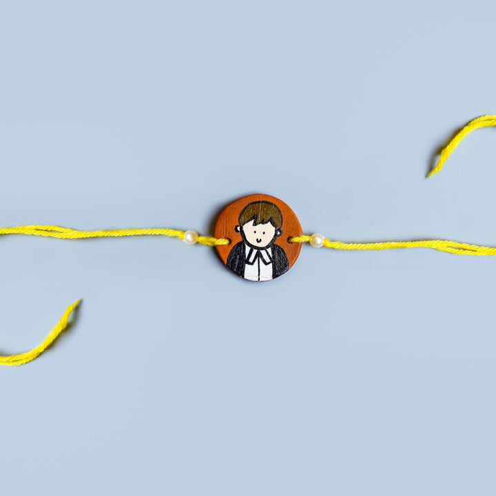 Personalized Profession Theme Terracotta Rakhi With Roli Chawal 2 - Flat Lay Front View