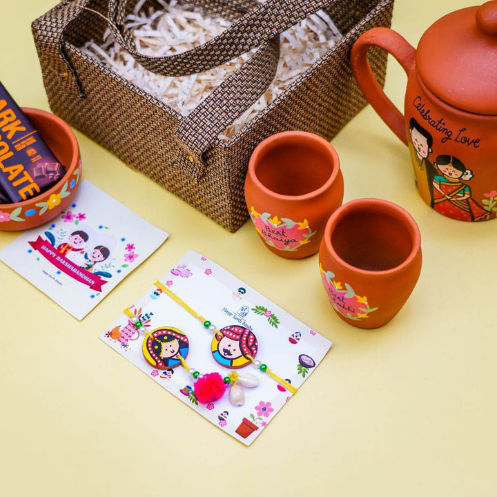 Personalized Terracotta Teaset Rakhi Hamper With Caricature - Products Outside Basket