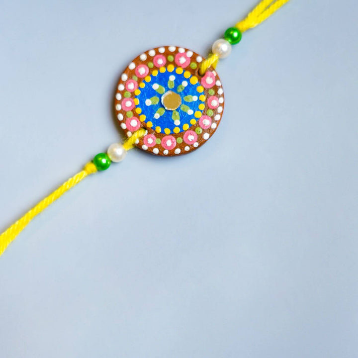 Handpainted Terracotta Rakhi Mug Set With Roli Chawal - Rakhi design close-up