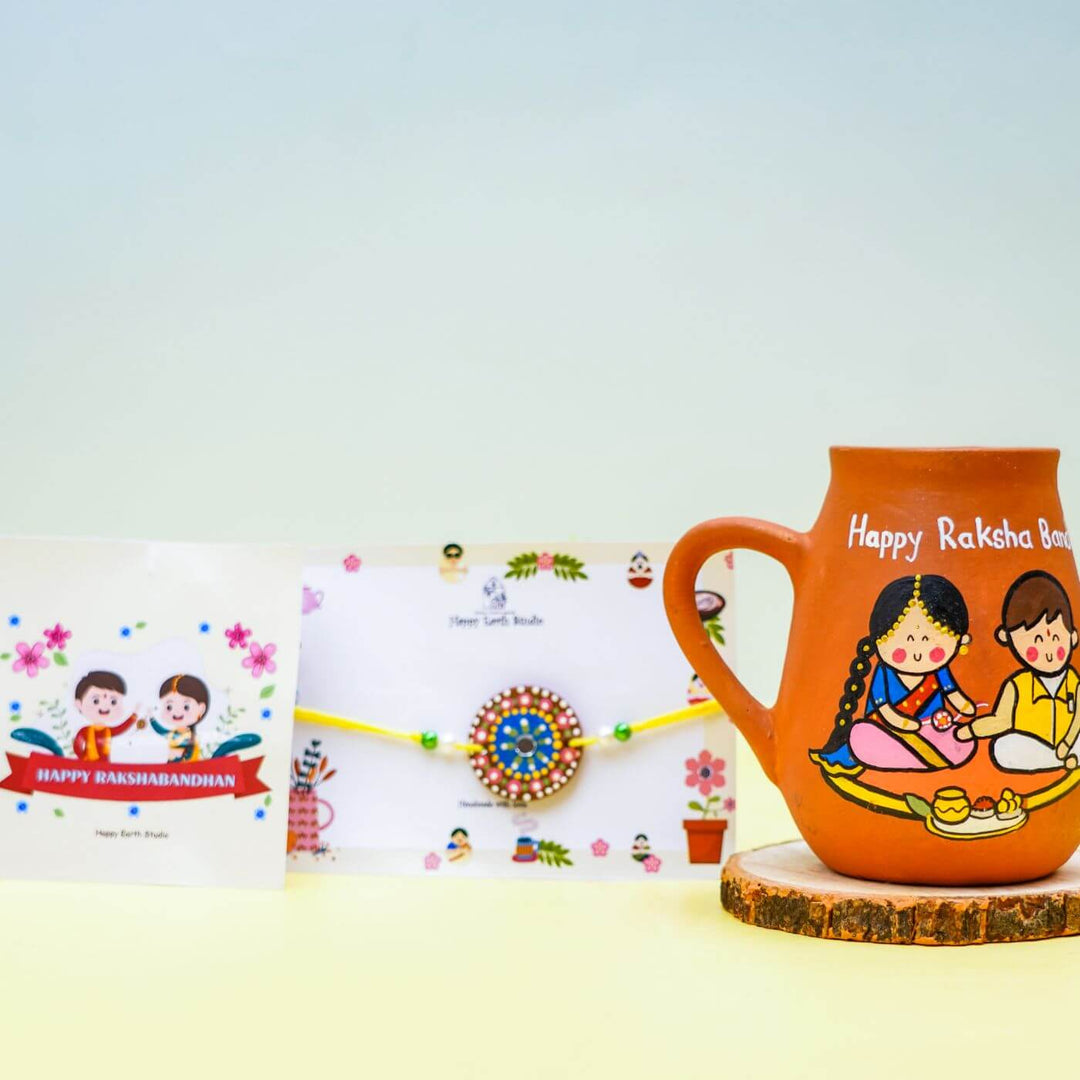 Handpainted Terracotta Rakhi Mug Set With Roli Chawal - Product and card set display