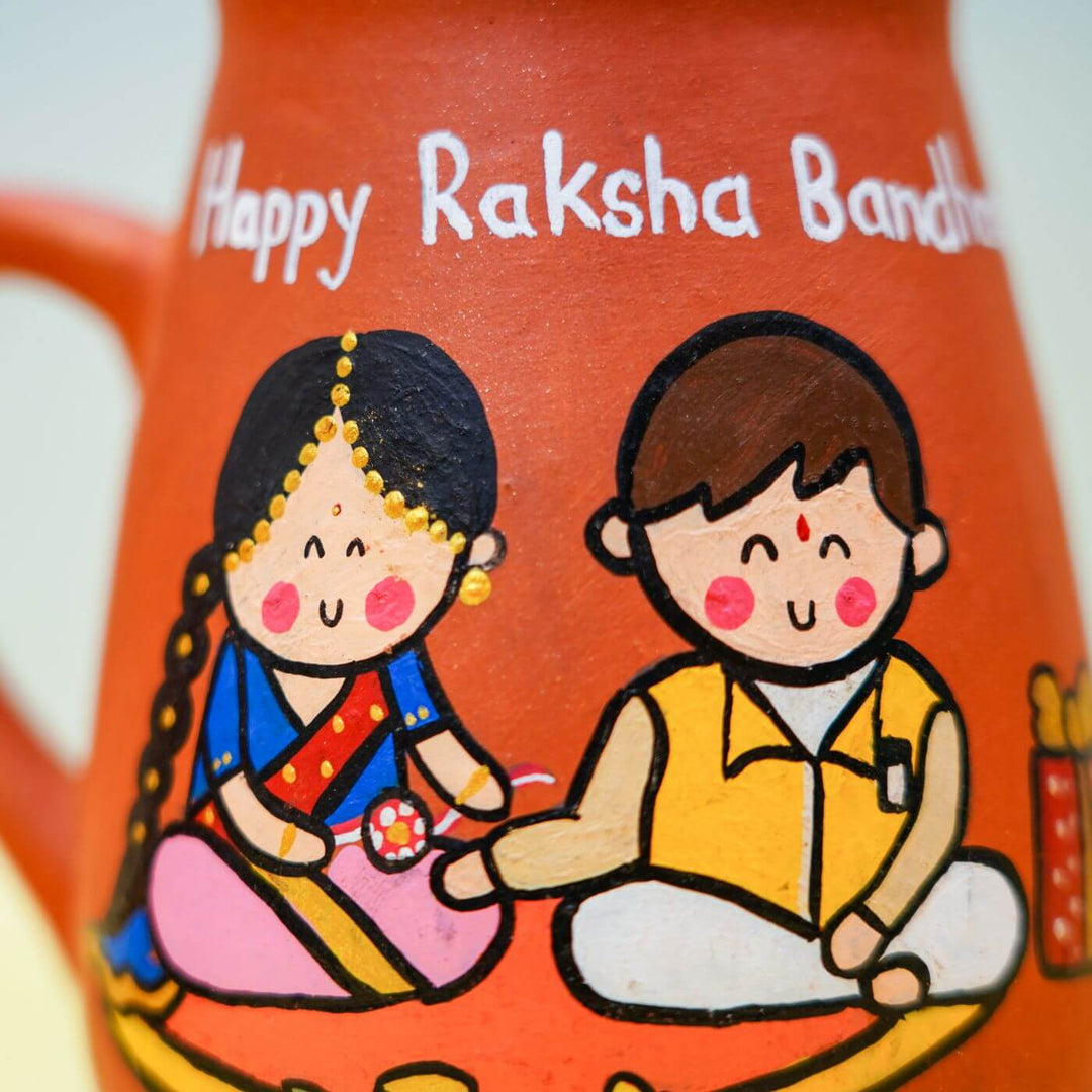 Handpainted Terracotta Rakhi Mug Set With Roli Chawal - Mug painted illustration close-up