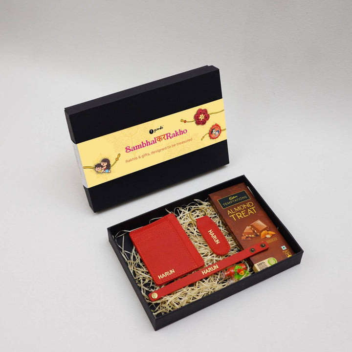 Personalised Rakhi Hamper With Genuine Leather Accessories - Gift Box Red Flat Lay