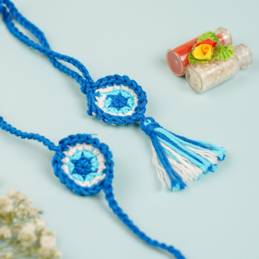 Handmade Crochet Evil Eye Bhaiya Bhabhi Rakhi With Roli Chawal Set Of 2 - Close-up of braided bracelet pair