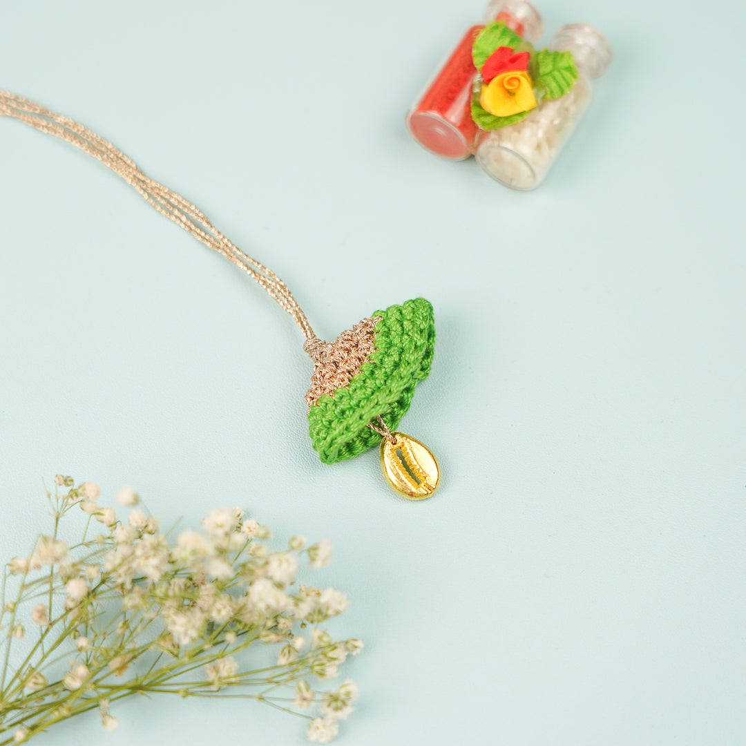 Handmade Crochet Cowry Beaded Lumba Rakhi For Bhabhi With Roli Chawal - Necklace Front View Green