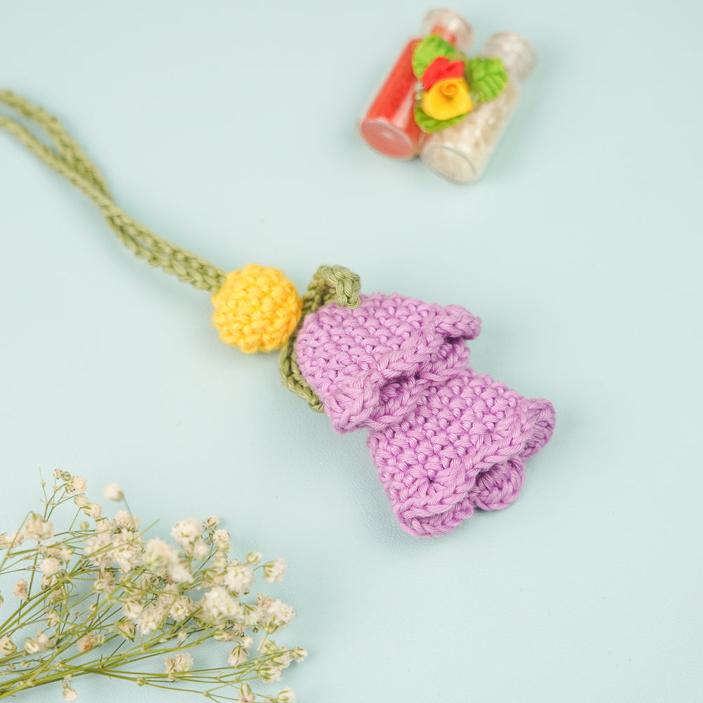 Handmade Crochet Tulip Lumba Rakhi For Bhabhi With Roli Chawal - Front View with Background Props