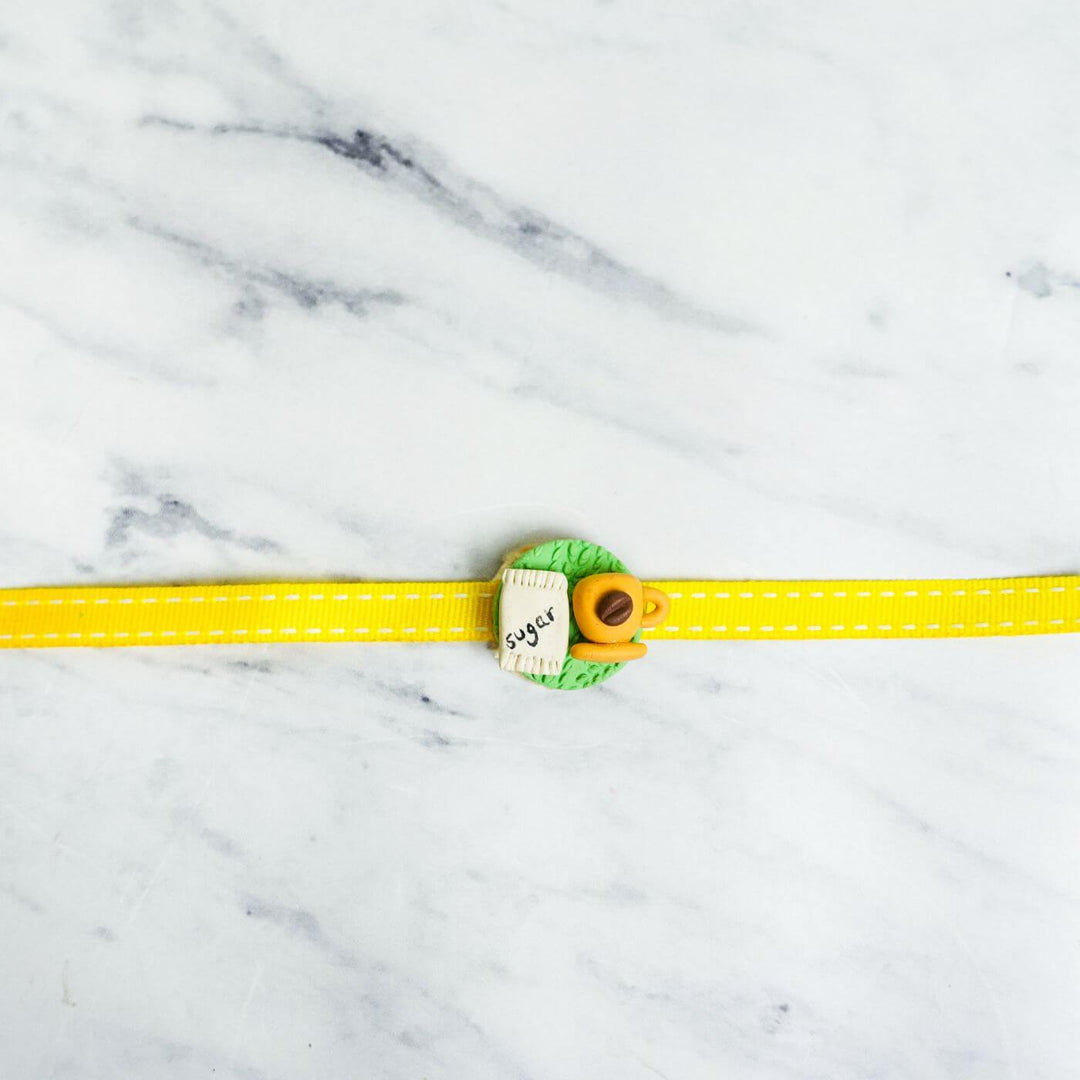 Handmade Porcelain Clay Themed Rakhi 4 - Single Rakhi Front View