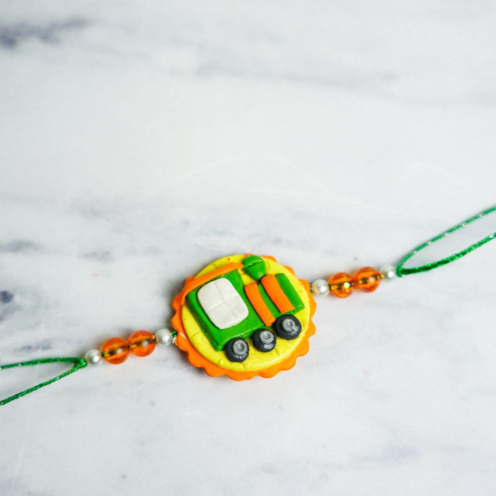 Handmade Porcelain Clay Themed Rakhi 11 - Front view of Rakhi with beads (8)