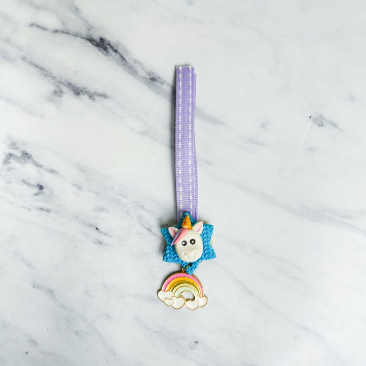 Handmade Porcelain Clay Themed Rakhi 7 - Front view of unicorn charm