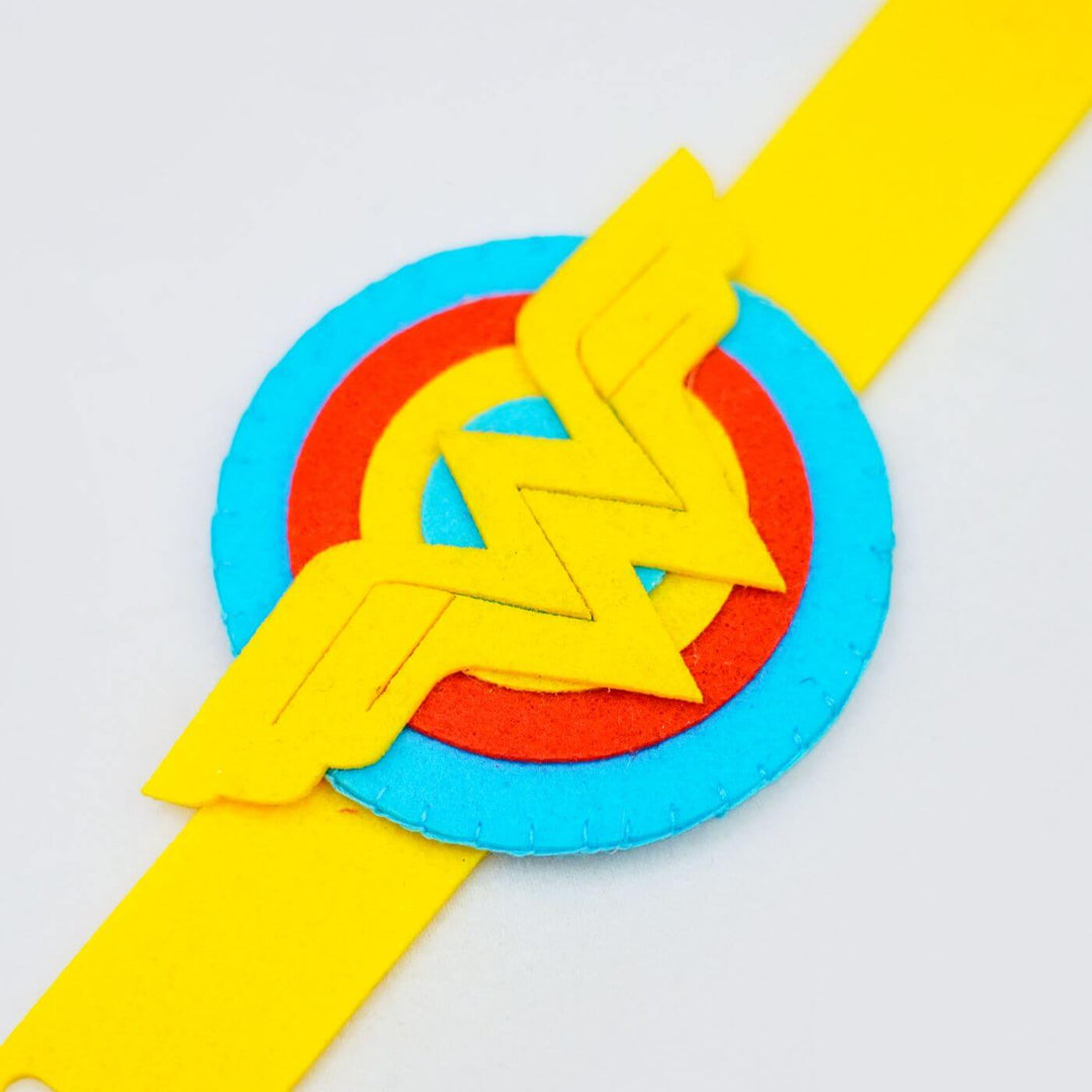 Kids Theme Felt Rakhi Band With Roli Chawal 3 - Close-up of winged emblem