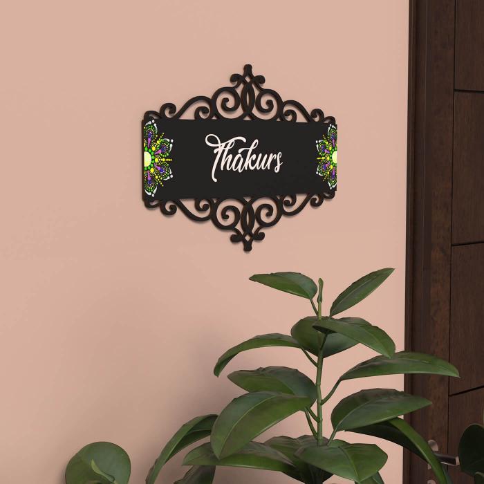 Dot Art Name Plate With Rectangular Cutwork Black - Mounted on Wall Above Plant