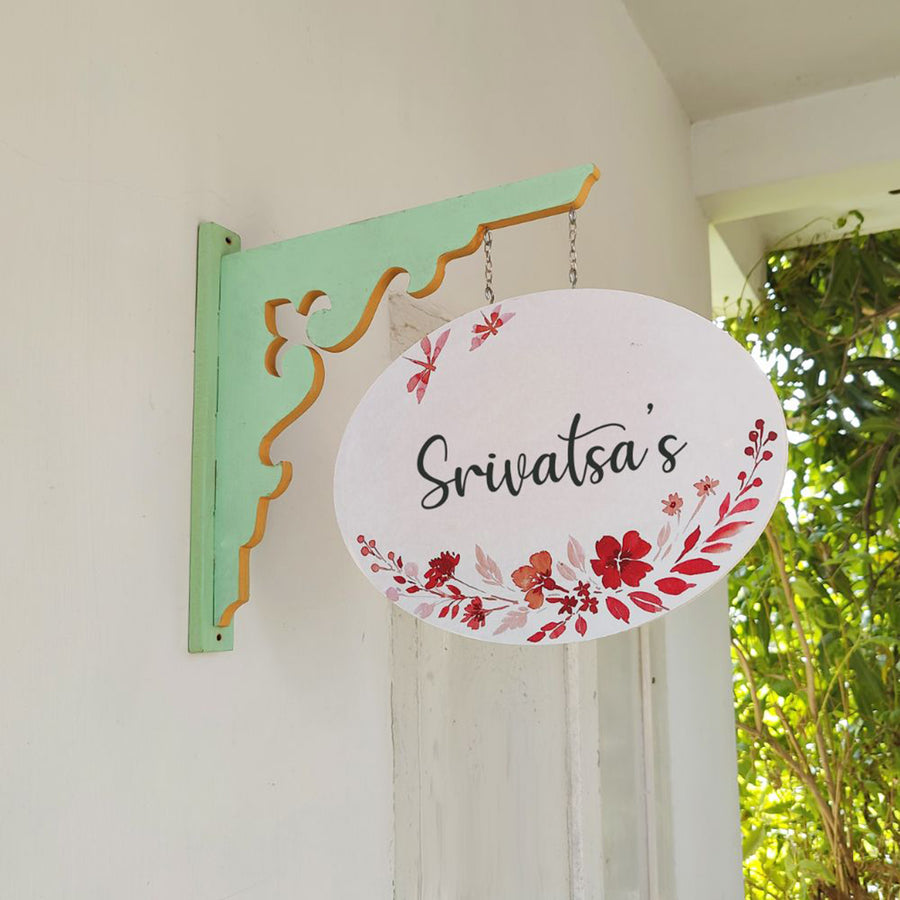 Hand Painted Oval Hanging Floral Name Plate 1 - Side View Hanging on Wall Bracket