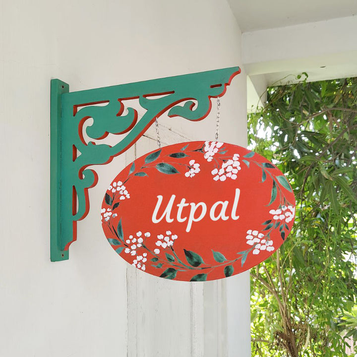 Hand Painted Oval Hanging Floral Name Plate 2 - Side View Hanging from Bracket