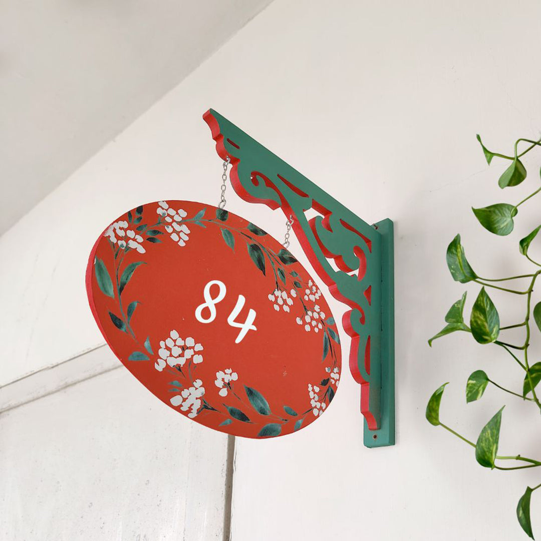 Hand Painted Oval Hanging Floral Name Plate 2 - Side View Hanging from Wall Bracket