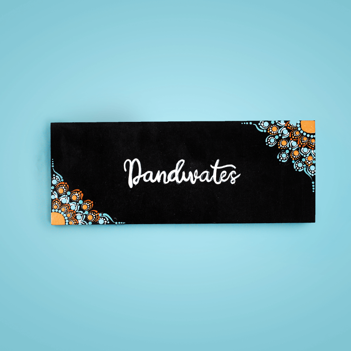 Small Dot Art Name Plate Family Name - Front View on Flat Surface
