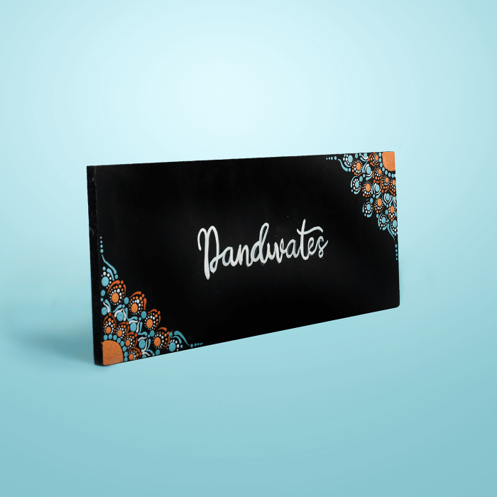 Small Dot Art Name Plate Family Name - Angled Front View on Flat Surface