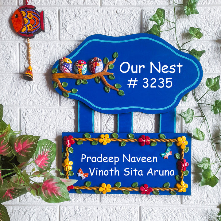 Handmade Owl Family Name Plate With Personalised Clay Figures - Mounted on Textured Wall Background