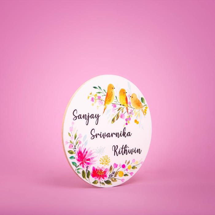 Circle Hand Painted Name Plate 3 - Angled Front View on Pink Background